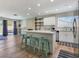 Bright, airy kitchen and living space with a large island and access to the outdoor pool area at 4072 E Harmon Ave, Las Vegas, NV 89121