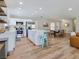 Open kitchen and dining area featuring white cabinets, stainless appliances, and stylish, modern furnishings at 4072 E Harmon Ave, Las Vegas, NV 89121