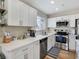 Bright, open kitchen with white countertops, stainless steel appliances, and modern fixtures at 4072 E Harmon Ave, Las Vegas, NV 89121