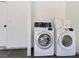 Efficient laundry area with a modern washer and dryer, with space for storage at 4072 E Harmon Ave, Las Vegas, NV 89121