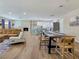 Bright living room with sleek wooden floors, comfortable seating, and easy access to the modern kitchen at 4072 E Harmon Ave, Las Vegas, NV 89121