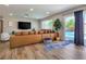 Bright and airy living room featuring a large sectional sofa and seamless access to the outdoor pool area at 4072 E Harmon Ave, Las Vegas, NV 89121