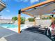 Inviting backyard pool area with a pergola, lounge seating, and privacy walls at 4072 E Harmon Ave, Las Vegas, NV 89121