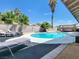 Backyard pool area with lounge chairs and patio, providing a perfect outdoor retreat at 4072 E Harmon Ave, Las Vegas, NV 89121