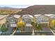 Stunning aerial view showcases a home's inviting curb appeal, modern design, and a desirable neighborhood setting at 41 Strada Moscato, Henderson, NV 89011