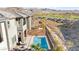 Aerial view of a modern home showcasing a pristine pool and a well-maintained backyard bordered by a fence at 41 Strada Moscato, Henderson, NV 89011