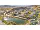 Aerial community view with pond, desert landscape, and mountain backdrop at 41 Strada Moscato, Henderson, NV 89011