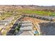 Aerial view of neighborhood homes with golf course and mountain views in distance at 41 Strada Moscato, Henderson, NV 89011