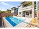Gorgeous backyard featuring a sparkling swimming pool, patio with outdoor kitchen, and desert landscaping at 41 Strada Moscato, Henderson, NV 89011