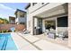 This backyard features a pool, outdoor seating area, and an exterior elevation of the home at 41 Strada Moscato, Henderson, NV 89011