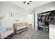 This Bedroom features a wood crib, accent wall color, and a full closet for baby's things at 41 Strada Moscato, Henderson, NV 89011