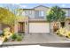 Attractive two-story home with a well-maintained lawn and a spacious two-car garage at 41 Strada Moscato, Henderson, NV 89011