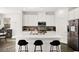 Modern kitchen with a large center island, stainless steel appliances, and ample cabinet space at 41 Strada Moscato, Henderson, NV 89011