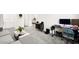 Spacious lower-level living room, with comfortable seating and dedicated office space at 41 Strada Moscato, Henderson, NV 89011