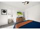 Bright main bedroom with ceiling fan, a TV, and ensuite bathroom access at 41 Strada Moscato, Henderson, NV 89011