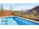 Private backyard swimming pool with desert landscaping and views of the surrounding hills in a quiet neighborhood at 41 Strada Moscato, Henderson, NV 89011