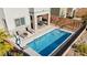 Backyard pool area with chaise lounges and patio seating, fully fenced for privacy at 41 Strada Moscato, Henderson, NV 89011