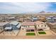 Many homes with fenced backyards and desert landscaping are showcased in this aerial community view at 453 Winter Dove Ave, Henderson, NV 89011