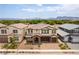 Stunning aerial view of a two-story home with a stone-accented entrance and desert landscaping at 453 Winter Dove Ave, Henderson, NV 89011