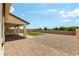 Spacious backyard featuring gravel, artificial grass, and a covered patio for outdoor living at 453 Winter Dove Ave, Henderson, NV 89011
