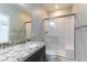 Bathroom boasts a granite vanity and walk-in shower with glass door at 453 Winter Dove Ave, Henderson, NV 89011