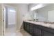 Bathroom features a granite countertop double vanity and access to the toilet and shower at 453 Winter Dove Ave, Henderson, NV 89011