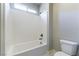 Bathroom features a tub shower and a toilet at 453 Winter Dove Ave, Henderson, NV 89011