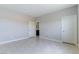 Large, light-filled bedroom showcasing tile flooring and multiple doorways at 453 Winter Dove Ave, Henderson, NV 89011