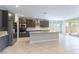 Open kitchen with granite countertops, stainless steel appliances, and modern cabinetry at 453 Winter Dove Ave, Henderson, NV 89011