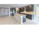 Modern kitchen with granite countertops, a central island, and stainless steel appliances at 453 Winter Dove Ave, Henderson, NV 89011
