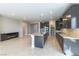 Open kitchen layout featuring granite countertops, stainless steel appliances, and an island at 453 Winter Dove Ave, Henderson, NV 89011