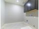 Well-lit laundry room with upper cabinets, and a sink for added convenience at 453 Winter Dove Ave, Henderson, NV 89011
