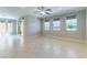 Bright living room featuring tiled floors, large windows, and backyard access at 453 Winter Dove Ave, Henderson, NV 89011