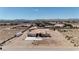 Expansive aerial view showcases a custom home with desert landscaping and panoramic mountain views at 4545 W Agate Ave, Las Vegas, NV 89139