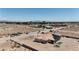 Scenic aerial view of a solar-paneled home in a desert landscape with distant city skyline at 4545 W Agate Ave, Las Vegas, NV 89139