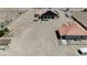 Wide aerial view of a sprawling desert property featuring multiple structures and ample space at 4545 W Agate Ave, Las Vegas, NV 89139