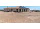 Well-maintained backyard with ample space, including a patio seating area and desert landscape at 4545 W Agate Ave, Las Vegas, NV 89139
