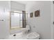 Simple bathroom with a bidet, toilet, and shower with a clear sliding glass door at 4545 W Agate Ave, Las Vegas, NV 89139