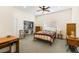 Cozy bedroom with carpet, ceiling fan, closet, and a comfortable-looking quilt on the bed at 4545 W Agate Ave, Las Vegas, NV 89139