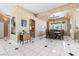 Open dining room with recessed ceiling and tile flooring throughout at 4545 W Agate Ave, Las Vegas, NV 89139