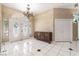 Bright foyer with double front doors, decorative chandelier, and tile flooring at 4545 W Agate Ave, Las Vegas, NV 89139