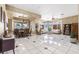 Open concept living room with view of the dining area and large windows at 4545 W Agate Ave, Las Vegas, NV 89139