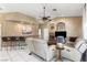 Comfortable living room with bar area, fireplace, and tile flooring at 4545 W Agate Ave, Las Vegas, NV 89139