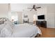 Comfortable main bedroom showcasing a fireplace and archway leading to the ensuite bathroom at 4545 W Agate Ave, Las Vegas, NV 89139
