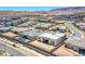 Aerial view of a new construction home featuring modern architecture in a developing neighborhood at 4750 Outlook Peak St, Las Vegas, NV 89135