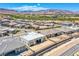 Aerial view of a modern home in a suburban neighborhood with mountain views at 4750 Outlook Peak St, Las Vegas, NV 89135