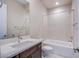 Bathroom boasts a modern vanity, toilet and shower-tub combo at 4750 Outlook Peak St, Las Vegas, NV 89135