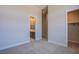 Spacious bedroom with neutral carpeting and ensuite bathroom at 4750 Outlook Peak St, Las Vegas, NV 89135