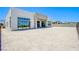 Modern home exterior featuring a spacious backyard with stone pavers and potential for landscaping at 4750 Outlook Peak St, Las Vegas, NV 89135