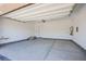 Spacious and bright two car garage featuring a clean concrete floor and new construction at 4750 Outlook Peak St, Las Vegas, NV 89135